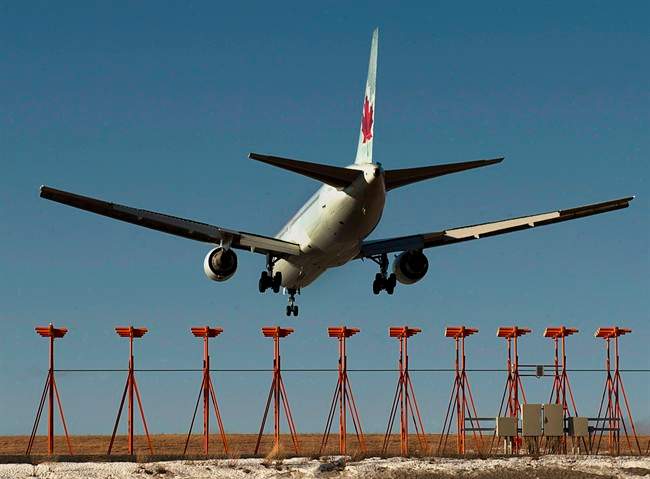 An Air Canada passenger jet lands at Halifax Stanfield International Airport in Halifax on Jan. 21, 2013. The union representing about 4,100 Air Canada customer service and sales agents has reached a tentative five-year collective agreement with the airline.