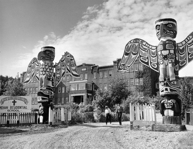St. Michael’s Indian Residential School entrance, with two students on the driveway, in Alert Bay, B.C., is shown in a 1970 handout photo. The Truth and Reconciliation Commission examining Canada’s residential-school system has released a summary of its six-volume report, the culmination of six years of study of the church-run, government-funded institutions, which operated for more than 120 years.