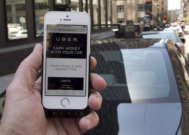 The ride-sharing app Uber is shown on a smartphone in Montreal, Thursday, May 14, 2015.
