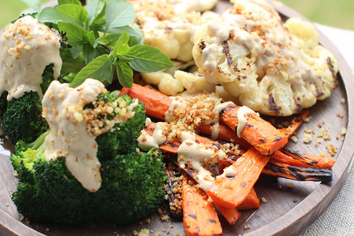 This June 8, 2015 photo shows grilled vegetables with tahini sauce and spicy panko in Concord, N.H. This dish is from a recipe by Sara Moulton.