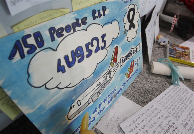 A painting is put up in a terminal of the airport commemorating the people who died in the Germanwings plane crash in France in Duesseldorf, Germany, Wednesday, June 10, 2015.
