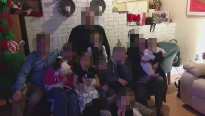 A photo of J.P., some family members, and her four children. They can’t be identified due to a publication ban.