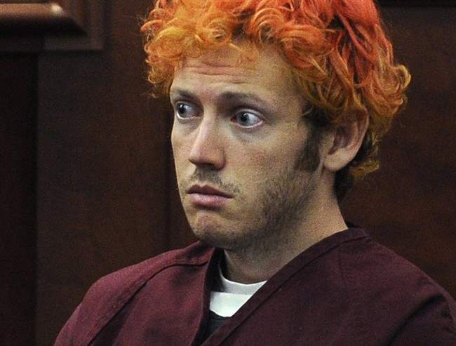 In this July 23, 2012, file photo, James Holmes, who is charged with killing 12 moviegoers and wounding 70 more in a shooting spree in a crowded theatre in 2012, sits in Arapahoe County District Court in Centennial, Colo.