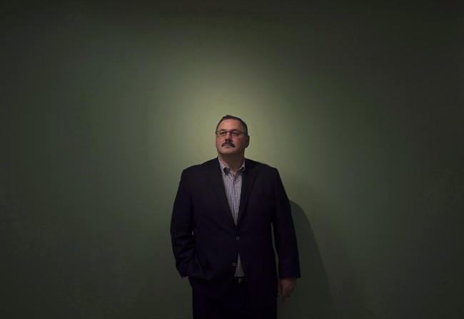 Ronald Boire poses at the Sears Canada headquarters in Toronto on November 12, 2014. 