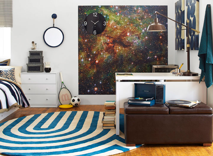 This photo provided by courtesy of Wayfair and Laura Moss Photography shows a dorm room. It's a design dream and a challenge: how to outfit a small, nondescript college dorm room. DwellStudio founder and creative director Christiane Lemieux's tips include hanging a temporary, adhesive mural and incorporating attractive bedding that coordinates with the room.