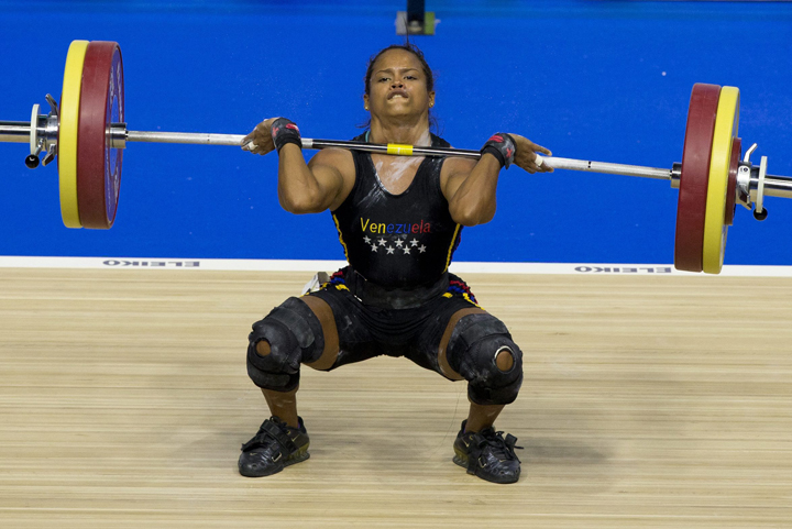Venezuela's Genesis Rodriguez Gomez attempts a lift in the women's 53kg weightlifting at the Pan Am Games in Oshawa, Ontario, Sunday, July 12, 2015.