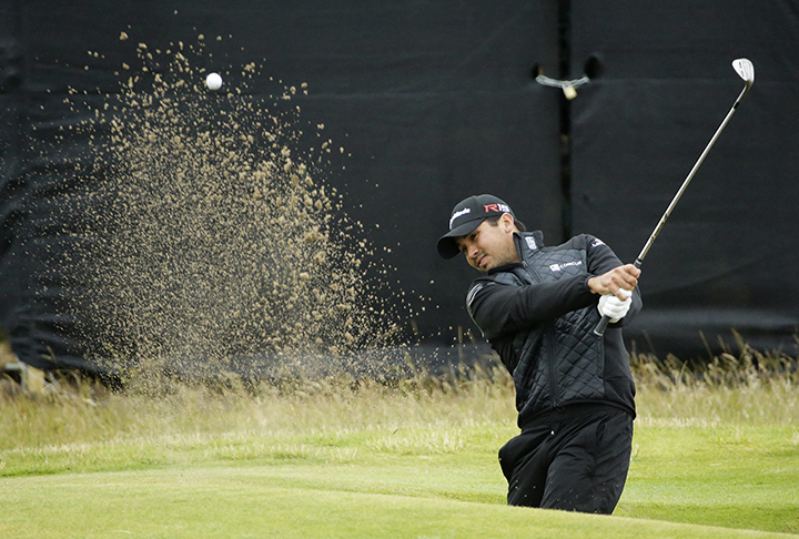 Australia’s Jason Day plays out of a bunker on the tenth hole during the final round at the British Open Golf Championship at the Old Course, St. Andrews, Scotland, Monday, July 20, 2015.
