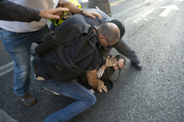 Police arrest an ultra-Orthodox Jew after he attacked people with a knife during a Gay Pride parade Thursday, July 30, 2015 in central Jerusalem. Israeli police said several people were stabbed.