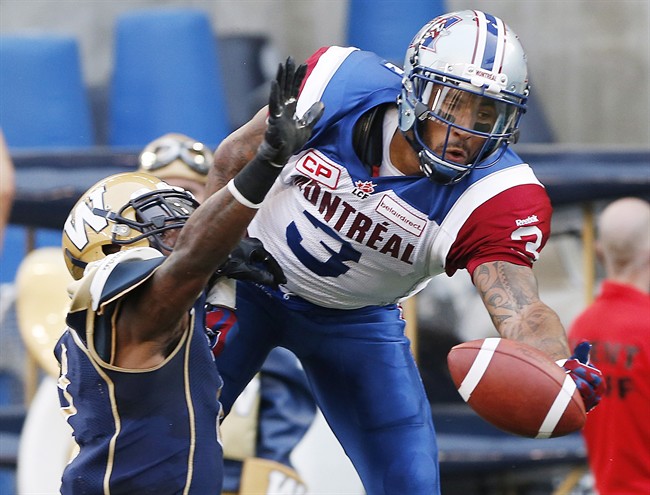 Winnipeg Blue Bombers' Demond Washington (7) defends as Montreal Alouettes' Cody Hoffman (3) can't haul in this pass in the Bombers' end zone during the first half of CFL action in Winnipeg Friday, July 10, 2015.