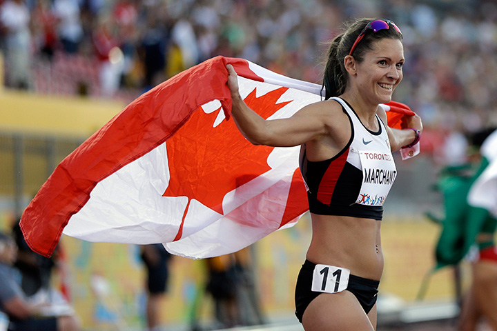 Canada’s Lanni Marchant celebrates after winning the bronze medal in the women’s 10,000m run at the Pan Am Games in Toronto on Thursday, July 23, 2015.