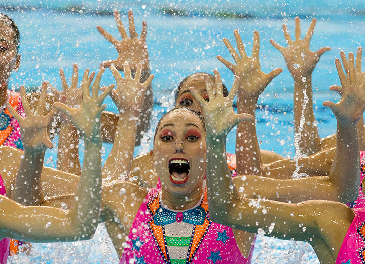 Mexico’s synchronized swimming team performs a clown inspired number for the free routine at the Pan Am Games in Toronto on Saturday, July 11, 2015.