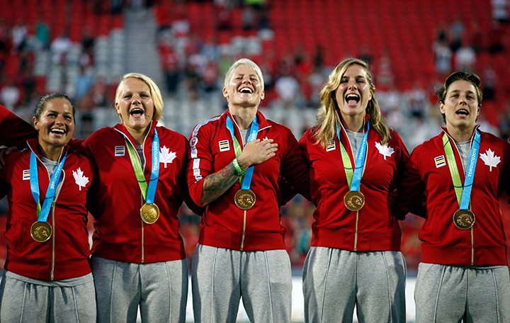 Canada celebrates on the podium after they won the gold medal in the women’s Rugby 7 competition on Day 2 of the Toronto 2015 Pan Am Games on July 12, 2015 in Toronto.