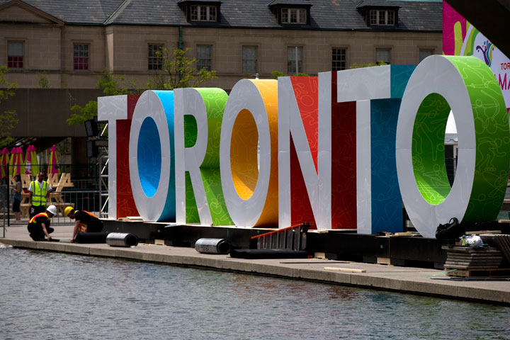 Workers erect giant letters spelling out Toronto in Nathan Phillips Square as they prepare for the Pan Am Games, Wednesday, July 8, 2015. The 2015 Pan Am Games officially open in Toronto on July 10.