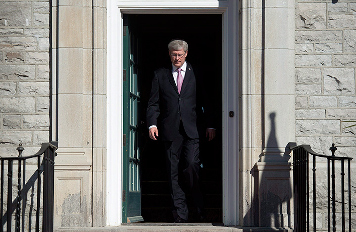 Prime Minister Stephen Harper steps out of his residence at 24 Sussex drive Monday June 9, 2014 in Ottawa.