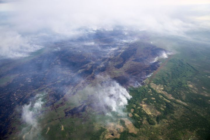 Out-of-control wildfire burns near North Tallcree First Nation Saturday, July 4, 2015.
