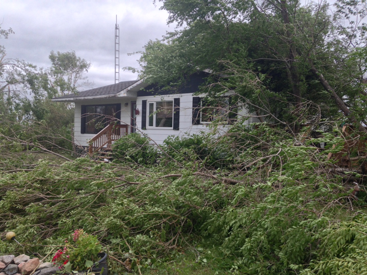 tornado house damage Manitoba storm trees down