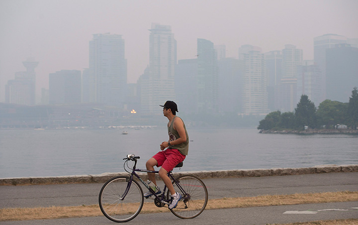 Smoke from wildfires in the interior of British Columbia blanket downtown Vancouver, B.C. Sunday, July 5 2015. 