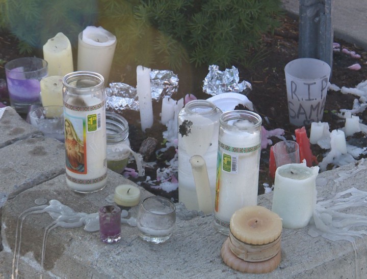 Candles left behind after a vigil for Samantha Higgins, 22, who was found murdered on Friday, July 10, 2015.