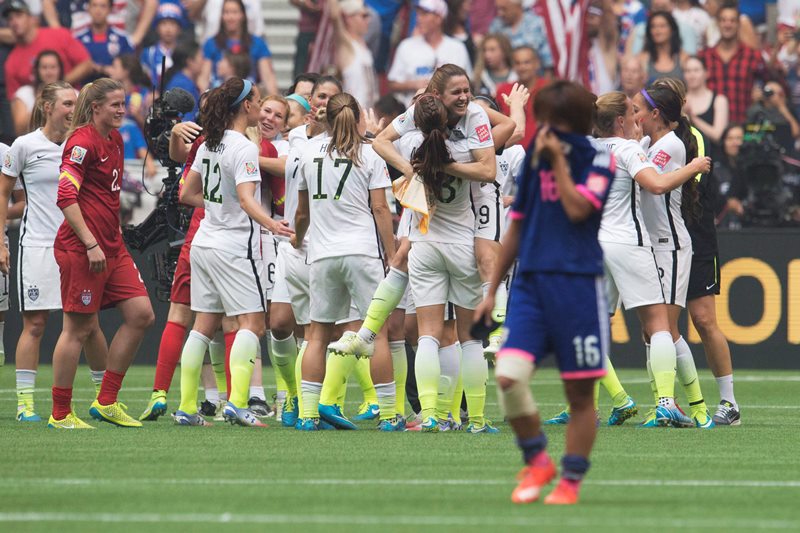 Japan’s Mana Iwabuchi looks on as the United States celebrates their victory in the FIFA Women’s World Cup soccer final in Vancouver, B.C., on Sunday, July 5, 2015.