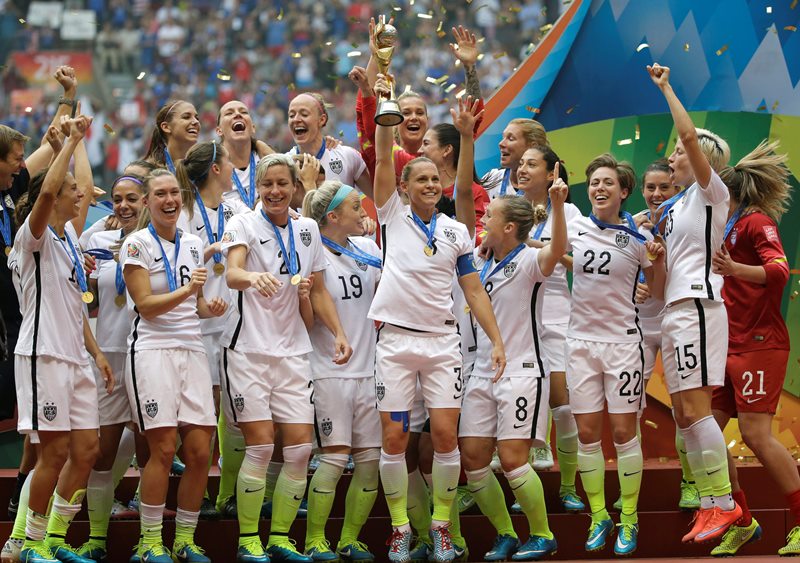 The United States Women’s National Team celebrates with the trophy after they beat Japan 5-2 in the FIFA Women’s World Cup soccer championship in Vancouver, British Columbia, Canada, Sunday, July 5, 2015.