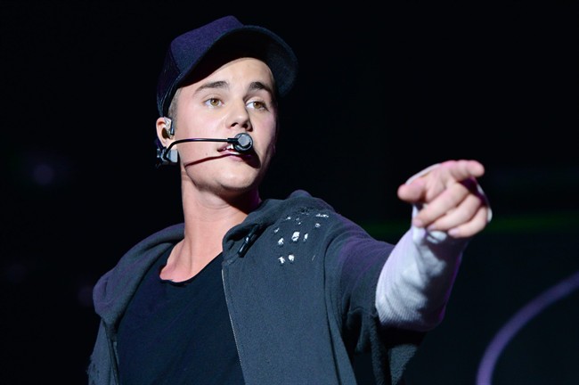 FILE - In this Sunday, Aug. 23, 2015 file photo, recording artist Justin Bieber performs at the 2015 Billboard Hot 100 Music Festival at Nikon at Jones Beach Theater in Wantagh, N.Y. 