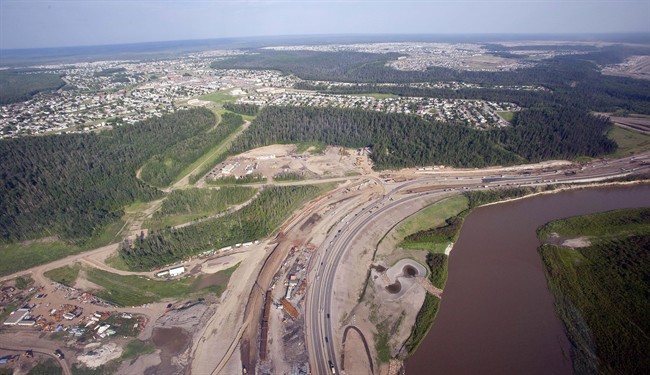 The Athabasca river, highway construction and suburbs seen from a helicopter in Fort McMurray, Alta., on July 10, 2012. 