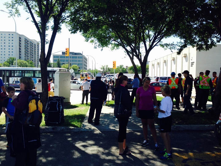 Kids from a hockey camp waiting outside the Winnipeg Winter Club during a gas leak