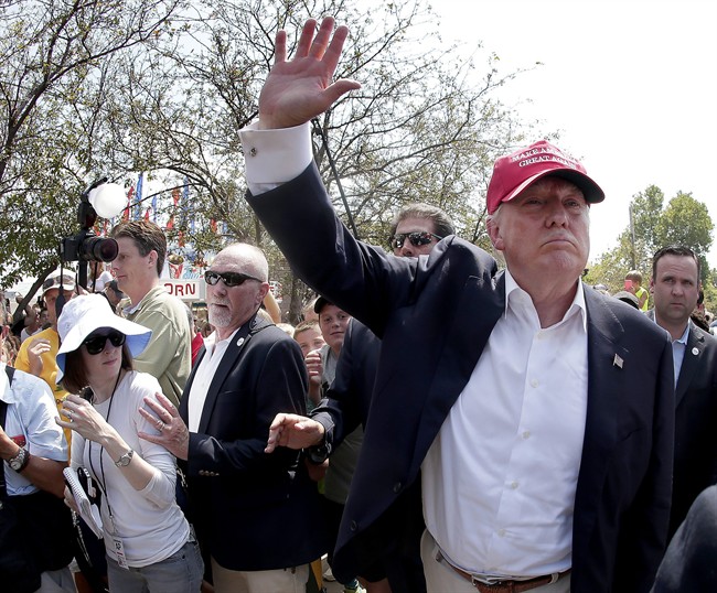 Republican presidential candidate Donald Trump waves to the crowd at the Iowa State Fair Saturday, Aug. 15, 2015, in Des Moines. 