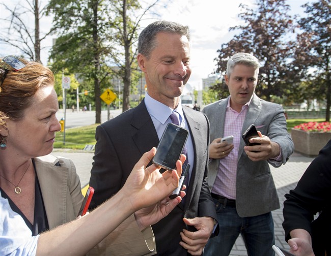 Nigel Wright, former chief of staff to Prime Minister Stephen Harper, arrives at the courthouse in Ottawa on Thursday, Aug. 13, 2015 for his second day of testimony at the criminal trial of embattled Sen. Mike Duffy.