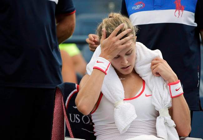 Eugenie Bouchard takes a break between games against Dominika Cibulkova during the third round of the U.S. Open tennis tournament, Friday, Sept. 4, 2015, in New York. 