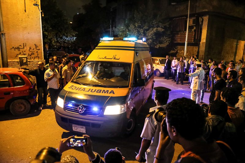 An ambulance carrying an Egyptian victim of Sunday's incident in which Egyptian forces mistakenly opened fire on tourists in the western desert, arrives at a morgue in Cairo, Egypt, Monday, Sept. 14, 2015. 