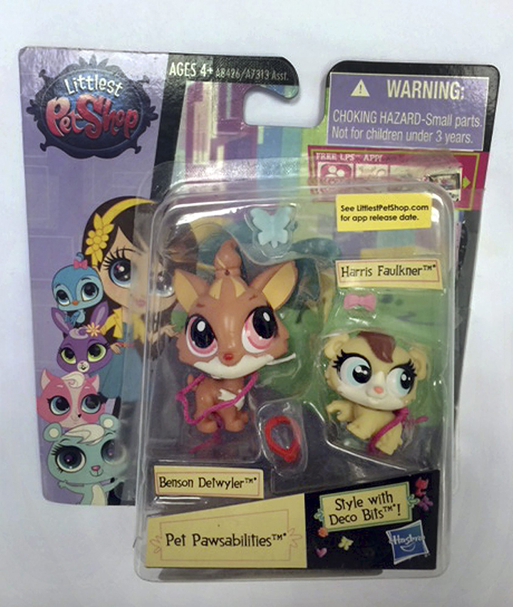 This June 23, 2015 photo released by the Hogan Lovells law firm shows toys from Hasbro’s “Littlest Pet Shop” line in New York, including characters named Benson Detwyler and Harris Faulkner.
