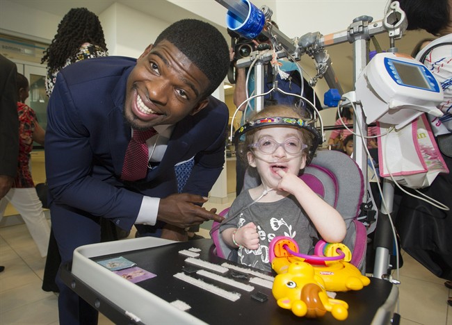 Montreal Canadiens defenceman P.K. Subban meets a young patient following a press conference at the Children's Hospital in Montreal, Wednesday, September 16, 2015, where he announced that his foundation would pledge $10-million to the hospital.
