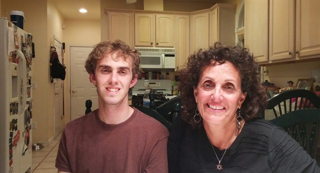 This Friday, Sept. 18, 2015 photo shows Terri Gifford, right, 56, and her son Brian Gifford, 23, at her and her husband Peter Gifford's home in New Rochelle, N.Y. Brian Gifford has lived at home with his parents for the past two years, since graduating college.