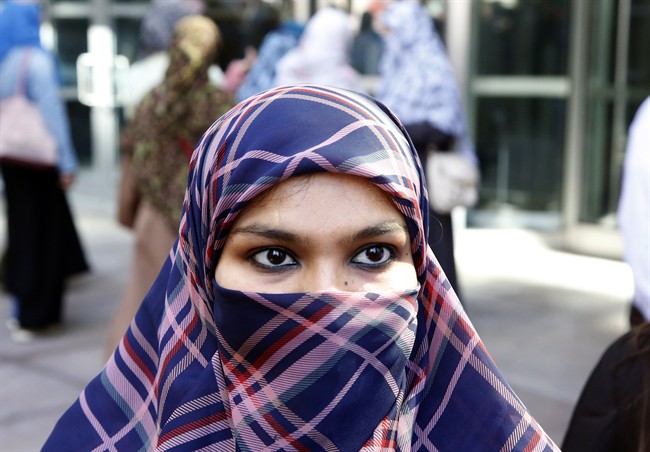 Zunera Ishaq talks to reporters outside the Federal Court of Appeal after her case was heard on whether she can wear a niqab while taking her citizenship oath, in Ottawa on Tuesday, September 15, 2015.