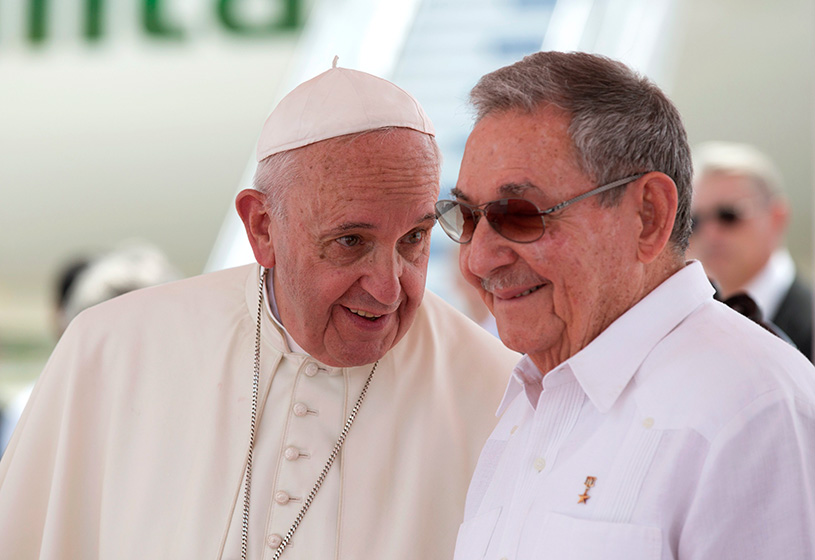 Pope Francis speaks with Cuba’s President Raul Castro during his farewell ceremony at the airport in Santiago, Cuba, Tuesday, Sept. 22, 2015.