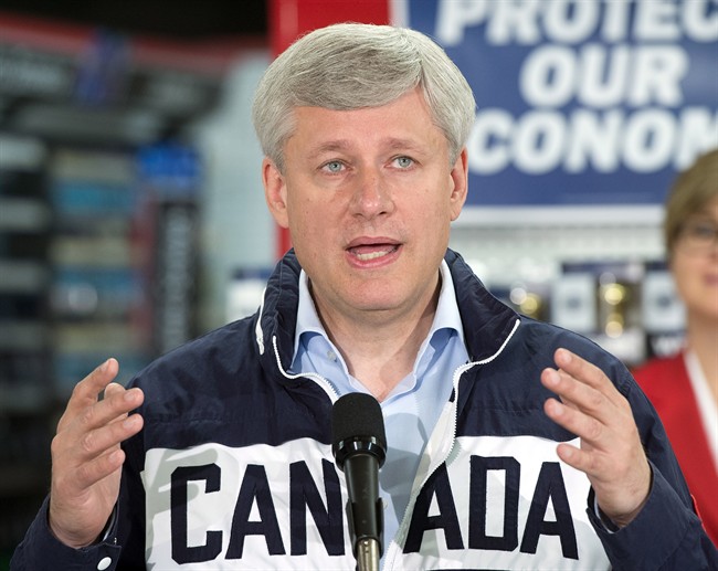 Conservative Leader Stephen Harper speaks to the media while campaigning at a hardware show, Monday, September 21, 2015 in St. Jacobs, Ont.