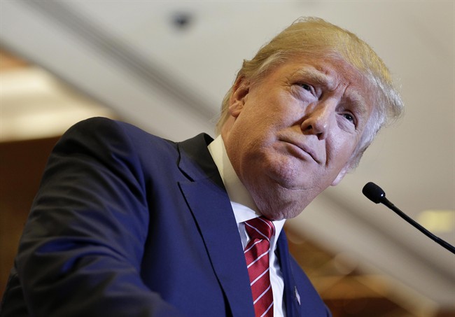 In this Sept. 28, 2015, photo, Republican presidential candidate Donald Trump pauses while speaking about his tax plan during a news conference in New York. 