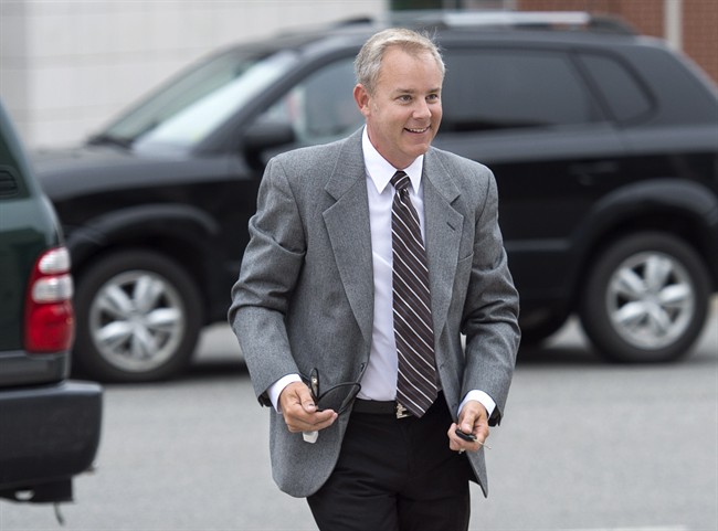 Dennis Oland arrives at the Law Courts in Saint John, N.B. on Wednesday, Sept. 9, 2015 as jury selection continues for his trial. .