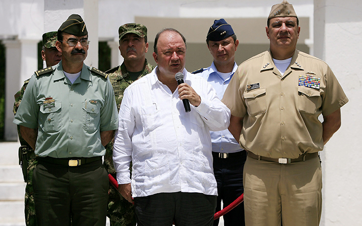 Colombian Defense Minister Luis Carlos Villegas speaks to the press flanked by top Colombian Armed Forces Commanders, to announce the killing of drugs lord and guerrillas leader Victor Ramon Navarro aka Megateo by Colombian authorities, during a military operation at Cataumbo region bordering Venezuela, in Santa Marta on October 2, 2015.