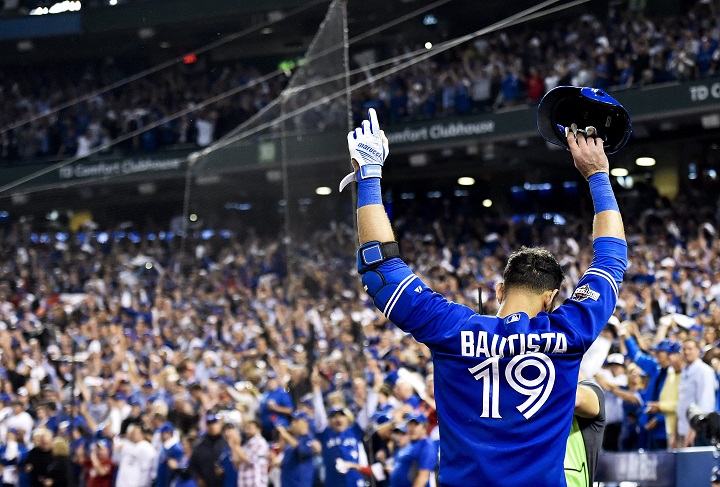 Toronto Blue Jays right fielder Jose Bautista acknowledges the crowd after hitting a three-run home run against the Texas Rangers during seventh inning game five American League Division Series playoff baseball action in Toronto on Wednesday, October 14, 2015.