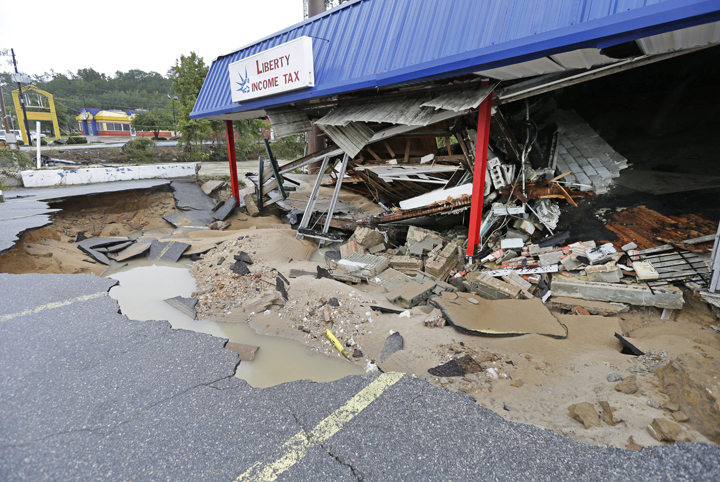 A business is destroyed by flooding in Columbia, S.C., Monday, Oct. 5, 2015.