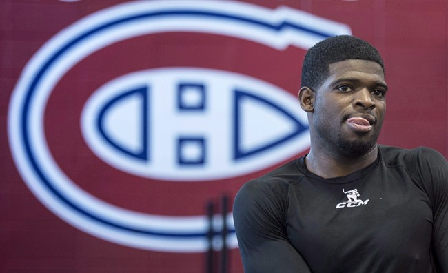 Montreal Canadiens P.K. Subban stretches during medical examinations on the first day of training camp Thursday, September 17, 2015 in Brossard, Que.