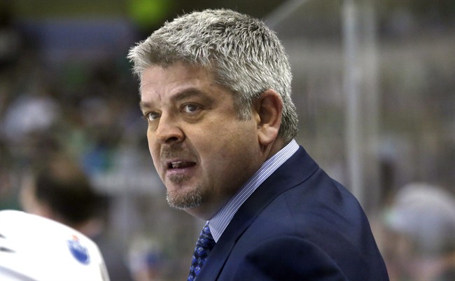 Edmonton Oilers head coach Todd McLellan watches from the bench during the first period of an NHL hockey game against the Dallas Stars on Oct. 13, 2015, in Dallas. Todd McLellan of the Edmonton Oilers will coach the 23-and-under Team North America at the upcoming World Cup of Hockey. McLellan was picked by North America general managers Peter Chiarelli, his boss in Edmonton, and Stan Bowman of the Chicago Blackhawks. 