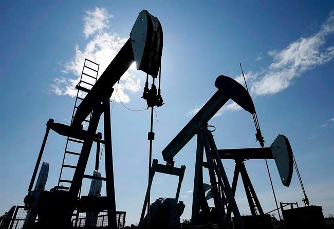 File: Pumpjacks at work pumping crude oil near Halkirk, Alta., June 20, 2007.
