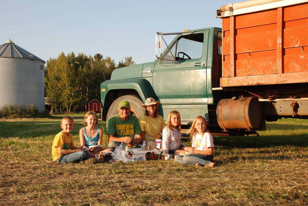 Parents Roger and Bonita Bott sit with their children Caleb, 9, Catie, 13, Jana, 11 and Dara, 11.
