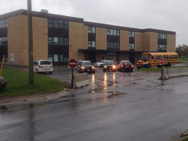 Heavy police presence outside Fredericton High School. The school and three others are on lockdown after a report of a teen with a gun in the area.