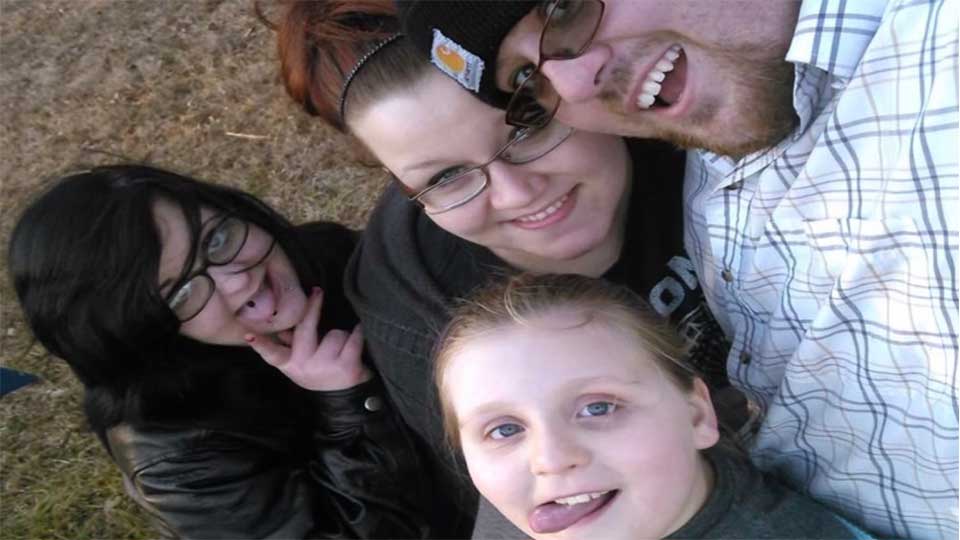 Justin McCary, seen here with his wife Elizabeth, daughter Haley and Mercedes Alexis Peters (far left).