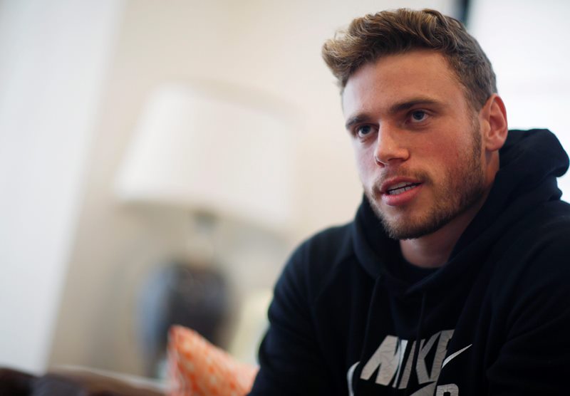 In this Wednesday, Oct. 21, 2015, photo, Gus Kenworthy, a freestyle skier who won a silver medal in Sochi, poses in his home in Denver. 