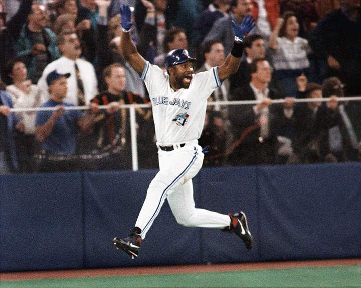 In this Oct. 23, 1993, file photo, Toronto Blue Jays' Joe Carter celebrates his game-winning, three-run home run in the ninth inning of Game 6 of the World Series in Toronto. 
